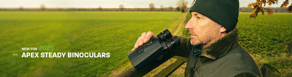 New for 2025 Apex Steady Binoculars (Man wearing warm clothes, holding binoculars while scanning the field ahead)