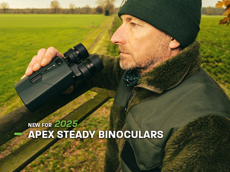 New for 2025 Apex Steady Binoculars (Man wearing warm clothes, holding binoculars while scanning the field ahead)